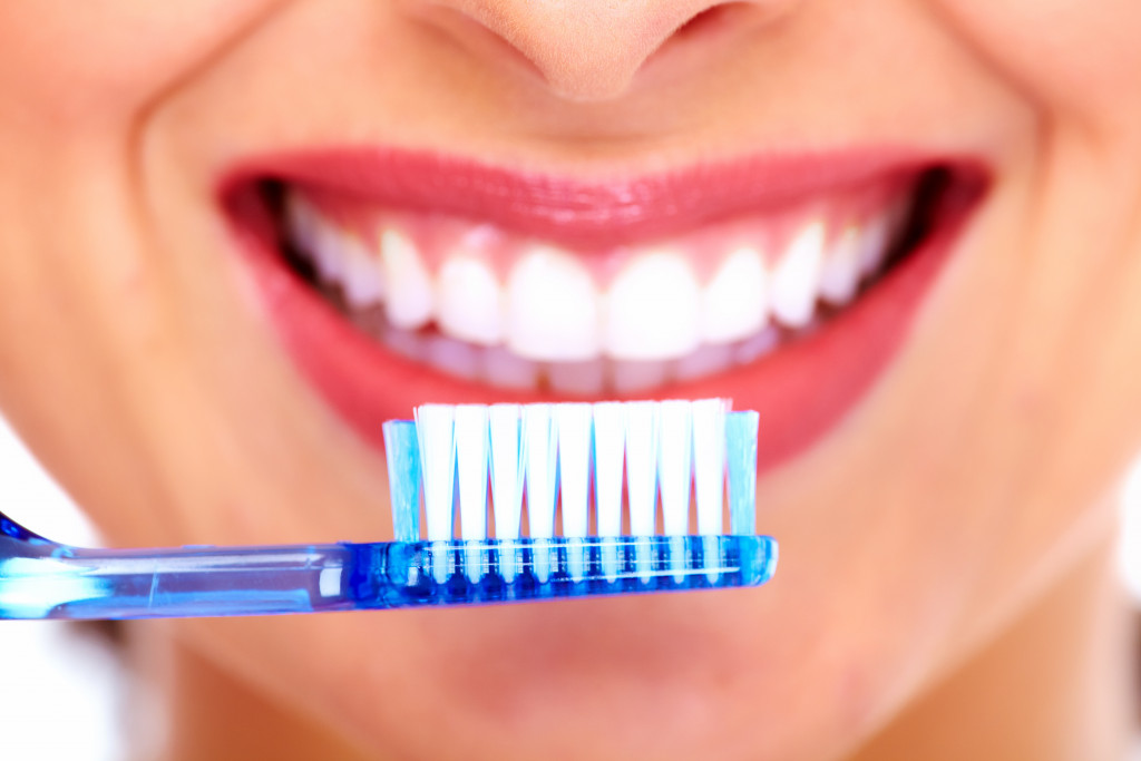 beautiful woman with toothbrush concept of oral health